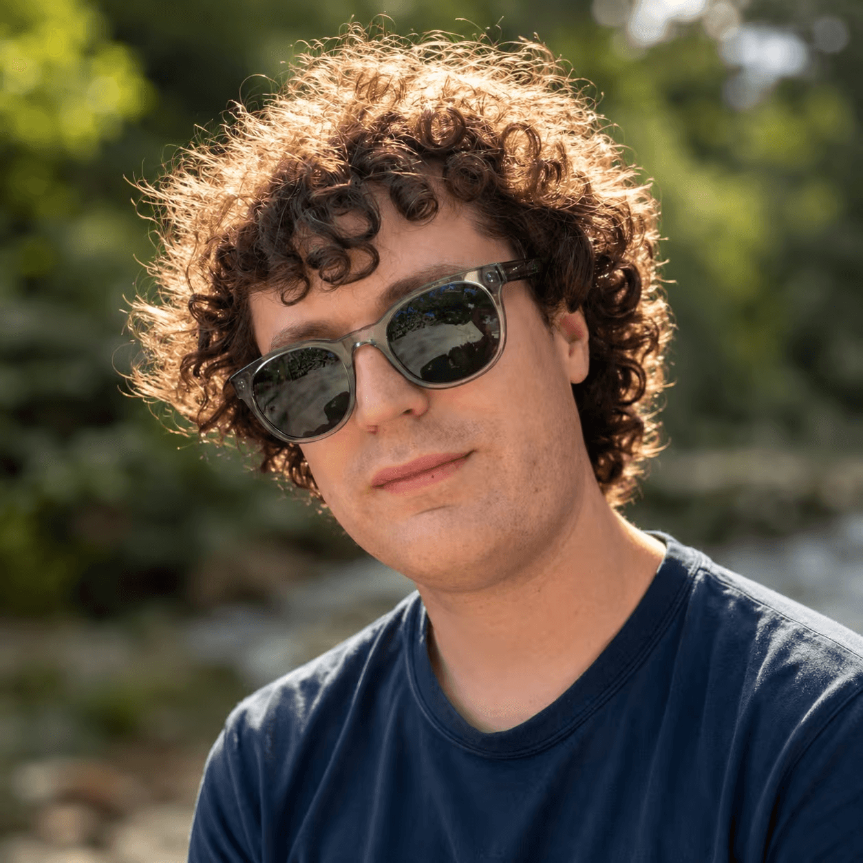 Alex Alford outdoors wearing sunglasses